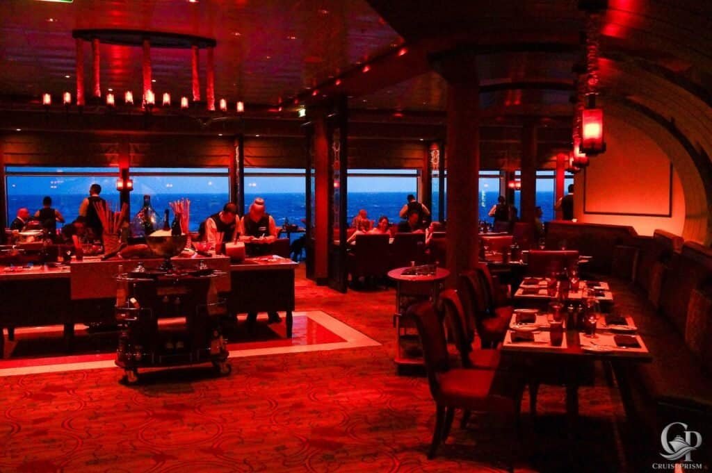 Celebrity Silhouette cruise Spacialty restaurant with ocean views and elegant ambiance at sunset.