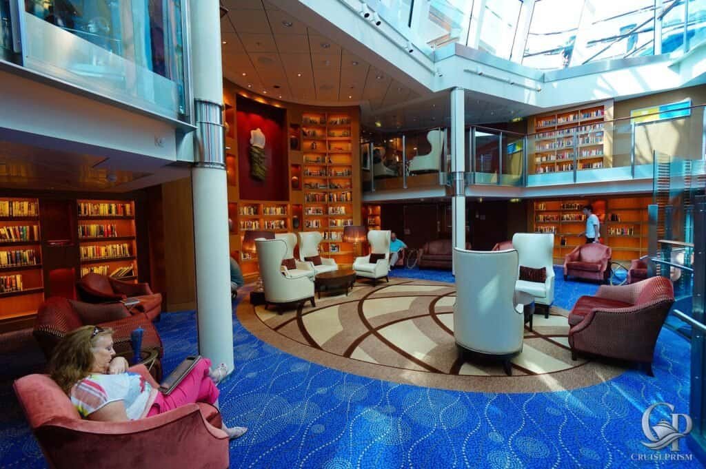 Relaxing Celebrity silhouette cruise ship library with comfortable seating and extensive book collection.
