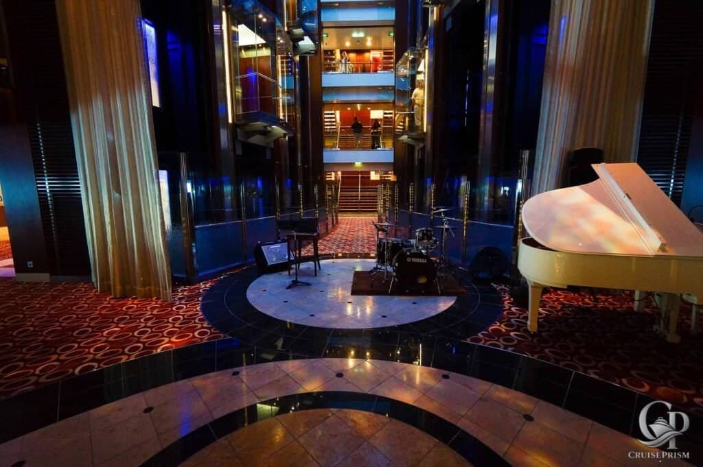 Celebrity silhouette Grand lobby with live music stage and luxurious decor.