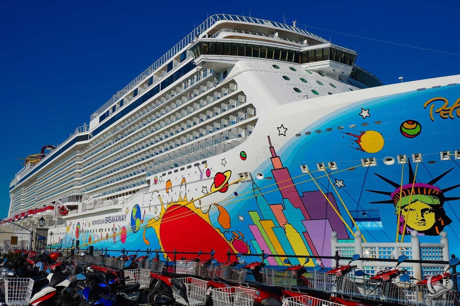 Norwegian Breakaway cruise ship with colorful space-themed artwork on the hull.