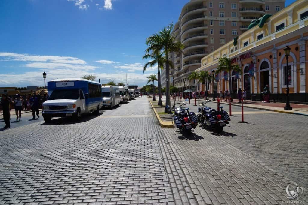 San Juan cruise port with palm trees, cruise ships, and vibrant cityscape.